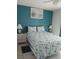 Bedroom with a seashell bedding and teal walls at 12172 Wild Acres Rd, Largo, FL 33773