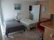 Two twin beds in a bright, cozy bedroom at 12172 Wild Acres Rd, Largo, FL 33773