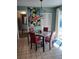 Charming breakfast nook with glass table and red chairs at 12172 Wild Acres Rd, Largo, FL 33773