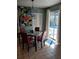 Bright kitchen nook with glass table and four chairs at 12172 Wild Acres Rd, Largo, FL 33773