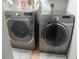 Laundry room with LG washer and Samsung dryer at 12172 Wild Acres Rd, Largo, FL 33773