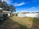 Backyard view with shed and landscaping at 12233 Bartkus Ct, Hudson, FL 34669