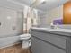 Simple bathroom with a shower/tub combo and gray vanity at 1614 Sea Breeze Dr, Tarpon Springs, FL 34689