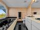 Bathroom with a large bathtub, double vanity, and a view at 1614 Sea Breeze Dr, Tarpon Springs, FL 34689