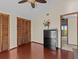 Spacious bedroom with wood floors and ample closet space at 1614 Sea Breeze Dr, Tarpon Springs, FL 34689