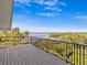 Spacious deck with stunning water views and a metal railing at 1614 Sea Breeze Dr, Tarpon Springs, FL 34689