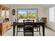 Dining area with dark wood table and chairs, overlooking a deck at 1614 Sea Breeze Dr, Tarpon Springs, FL 34689
