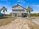 Two-story home on stilts, offering water views at 1614 Sea Breeze Dr, Tarpon Springs, FL 34689
