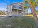 Elevated home with exterior elevator and waterfront access at 1614 Sea Breeze Dr, Tarpon Springs, FL 34689