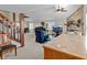 Open concept living room with hardwood floors and a view of the dining area at 1614 Sea Breeze Dr, Tarpon Springs, FL 34689