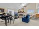 Living room with stone fireplace, piano, and comfortable seating at 1614 Sea Breeze Dr, Tarpon Springs, FL 34689