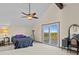 Spacious main bedroom with water views and ceiling fan at 1614 Sea Breeze Dr, Tarpon Springs, FL 34689