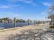 View of the marina with boats and waterfront seating at 1614 Sea Breeze Dr, Tarpon Springs, FL 34689