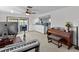 Home office/music room with piano, keyboard, and view of kitchen at 1614 Sea Breeze Dr, Tarpon Springs, FL 34689