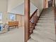 Wooden staircase leading upstairs, view from living room at 1614 Sea Breeze Dr, Tarpon Springs, FL 34689