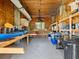 Organized storage room with shelving and kayak storage at 1614 Sea Breeze Dr, Tarpon Springs, FL 34689