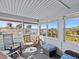 Sunroom boasts water views and comfortable seating at 1614 Sea Breeze Dr, Tarpon Springs, FL 34689