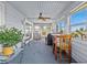 Relaxing sunroom with water views and wicker furniture at 1614 Sea Breeze Dr, Tarpon Springs, FL 34689