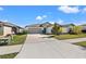 One-story house with a gray garage door and neatly landscaped yard at 16632 Sunburst Lake St, Wimauma, FL 33598