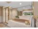 Relaxing bathroom featuring a large soaking tub and shower at 1695 Pinellas Bayway S # D1, Tierra Verde, FL 33715