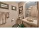 Small bathroom with beige sink, toilet and shower at 1695 Pinellas Bayway S # D1, Tierra Verde, FL 33715
