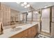 Double vanity bathroom with a shower and tiled floors at 1695 Pinellas Bayway S # D1, Tierra Verde, FL 33715