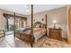 Charming bedroom with a four-poster bed and dresser at 1695 Pinellas Bayway S # D1, Tierra Verde, FL 33715