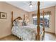 Charming bedroom with a four-poster bed and window seat at 1695 Pinellas Bayway S # D1, Tierra Verde, FL 33715