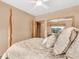 Bedroom with a queen bed, ceiling fan and mirrored closet at 1695 Pinellas Bayway S # D1, Tierra Verde, FL 33715