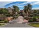 Resort-style community entrance with lush landscaping and gated access at 1695 Pinellas Bayway S # D1, Tierra Verde, FL 33715