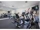 Bright fitness center with various equipment and mirrors at 1695 Pinellas Bayway S # D1, Tierra Verde, FL 33715