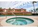 Community hot tub with surrounding tile deck at 1695 Pinellas Bayway S # D1, Tierra Verde, FL 33715