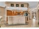 Kitchen with an island, wood cabinets, and tile flooring at 1695 Pinellas Bayway S # D1, Tierra Verde, FL 33715