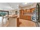Open kitchen with breakfast bar, stainless steel appliances, and tile floor at 1695 Pinellas Bayway S # D1, Tierra Verde, FL 33715