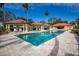Resort-style pool with cabanas and lounge chairs at 1695 Pinellas Bayway S # D1, Tierra Verde, FL 33715