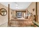 Spacious Primary bedroom with a king-size bed and balcony view at 1695 Pinellas Bayway S # D1, Tierra Verde, FL 33715