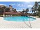 Resort-style community pool with comfortable lounge chairs at 1695 Pinellas Bayway S # D1, Tierra Verde, FL 33715