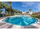 Inviting kidney-shaped community pool with surrounding patio at 1695 Pinellas Bayway S # D1, Tierra Verde, FL 33715