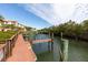 Community boardwalk leads to private boat docks at 1695 Pinellas Bayway S # D1, Tierra Verde, FL 33715