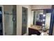 Bathroom with shower, vanity, and large mirror at 1743 Arabian Ln, Palm Harbor, FL 34685