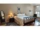 Bright bedroom with a king-size bed and hardwood floors at 1743 Arabian Ln, Palm Harbor, FL 34685