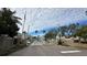 Gated community entrance with flags and signage at 1743 Arabian Ln, Palm Harbor, FL 34685