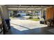 Garage with open door, showing view of the community at 1743 Arabian Ln, Palm Harbor, FL 34685