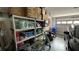 Organized garage with shelving and a bicycle at 1743 Arabian Ln, Palm Harbor, FL 34685