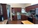 Spacious kitchen with granite countertops and stainless steel appliances at 1743 Arabian Ln, Palm Harbor, FL 34685