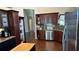 Kitchen boasts ample cabinetry, granite counters & stainless steel appliances at 1743 Arabian Ln, Palm Harbor, FL 34685