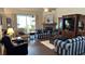 Bright living room featuring a cozy fireplace and hardwood floors at 1743 Arabian Ln, Palm Harbor, FL 34685
