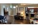 Open living space with hardwood floors and kitchen bar at 1743 Arabian Ln, Palm Harbor, FL 34685
