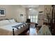Large main bedroom with an arched window and ample natural light at 1743 Arabian Ln, Palm Harbor, FL 34685