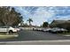Community parking lot with various cars parked at 1743 Arabian Ln, Palm Harbor, FL 34685